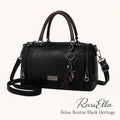 Bolsa Boston Black Heritage RariElla em fundo branco, modelo premium vintage com design estruturado, couro ecológico preto e alça dupla elegante.