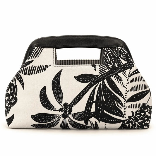 Bolsa Feminina de Lona Estampada Capri com estampa de folhagens e alça preta em fundo branco