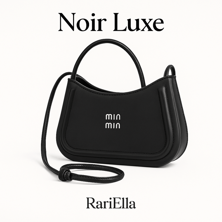 Bolsa feminina preta Noir Luxe da RariElla, modelo minimalista premium com design estruturado e alça ajustável, fotografada em fundo branco para e-commerce.
