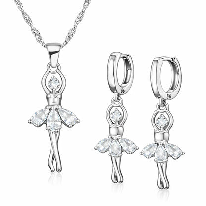 Conjunto Ballet Lumière em Prata 925 com pingente de bailarina e brincos delicados com zircônia cúbica, joia feminina elegante em fundo branco.