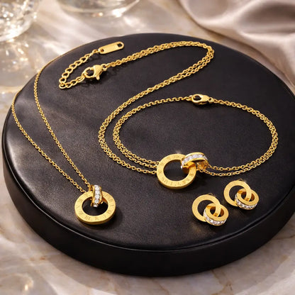 Conjunto de joias femininas douradas em aço inoxidável 18K com colar, pulseira e brincos de design infinito em acabamento premium cenario premuim