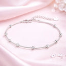 Pulseira feminina prata 925 delicada em fundo rosa com estilo moderno e sofisticado