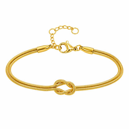 Pulseira feminina dourada Snake Duo Love minimalista com nó central elegante fundo branco