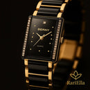 Close-up do Relógio Feminino Berny black gold, destacando caixa retangular, cristais e pulseira preto e dourado em foto premium RariElla.
